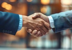 Handshake Between Business Professionals Signifying Agreement and Partnership